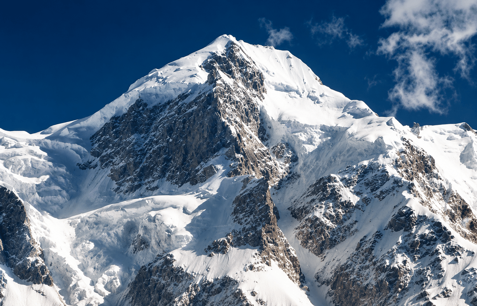 Snow-covered Himalayan summit during a guided 7000 meter expedition in India